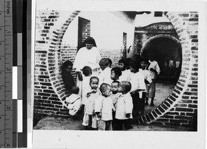 Orphans babies with Maryknoll Sister, Loting, China, ca. 1930