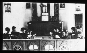 Boys praying in a chapel, China, ca. 1920-1940