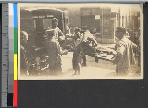 Patient being unloaded from an ambulance, Shanghai, China, ca.1924