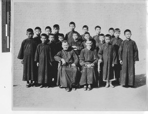 Maryknoll priests with students at Jiangmen, China, 1930