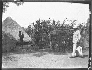 Mr Eberhardt in a village near Antioka, Mozambique, ca. 1901-1902