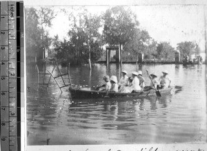 People in boat surveying flooded area, Pang Chuang, Shandong, China,1895