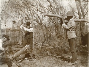 Man chopping wood, in Gabon