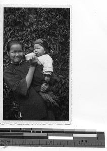 The first orphan recieved by Fr. McShane at Luoding, China, 1936