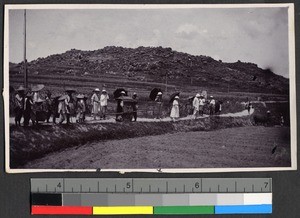 Missionaries and Chinese workers standing along a rural road, Hai Mng, Guangdong, China, ca. 1918-1922