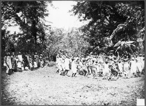 Children dancing around a new church bell, Tanzania, ca.1927-1938