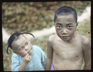 Female toddler looking at older brother, China, ca.1917-1923