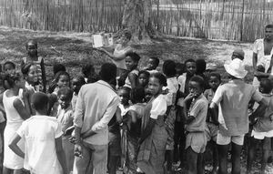 Missionary Anne Vibeke Mandrup is telling Bible stories to children in a village