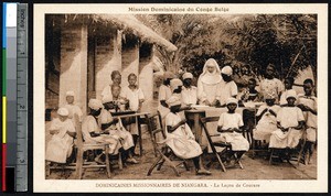 Missionary sister teaches girls to sew, Niangara, Congo, ca.1900-1930