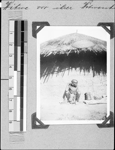 A widow in front of her hut, Msangano, Tanzania, 1937