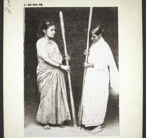 Christian women pounding rice. India