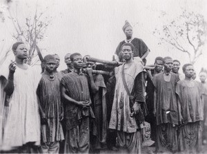 Nzabndunke, king Njoya's mother in a carrying chair, in Cameroon