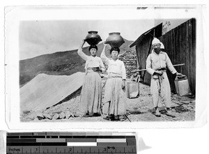 Two women and a man carrying water, Korea, ca. 1920-1940