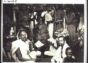 A swami, the high priest in a Lingayat monastery (India). Subordinate priests read the Besawapuran, a holy book. Students of the monastery - priests - students of the monastery