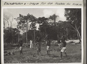 Breaking and carrying stones to rebuild the house in Kumba