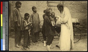 Dying child baptized on the street, China, ca.1920-1940