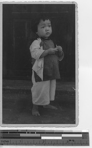 An orphaned child at Jiangmen, China, 1947