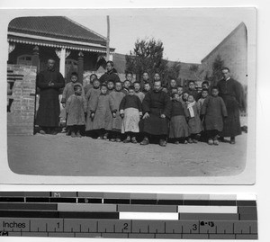 Fr. Joseph P. McCormack with school children at Andong, China, 1930