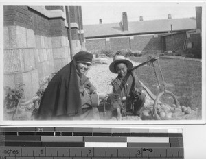 Maryknoll Sister bargains for potatoes at Dalian, China, 1931