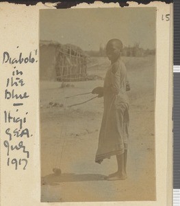 Boy playing with toy, Itigi, Tanzania, July 1917