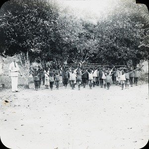 Class of boys exercising, Congo, ca. 1920-1930