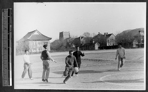 Students playing basketball, Jinan, Shandong, China, 1941