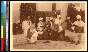 Missionary and men making embroidery designs on leather, Ghardaïa, Algeria, ca.1920-1940