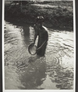 Malabar. Tya girl at her morning bath