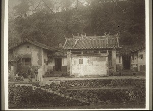 A little temple with other buildings from the same complex