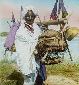 Man with shoulder pole, India, ca. 1920