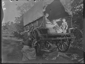 Female missionaries painting a wagon, Mhinga, South Africa, 1899