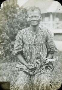 Older woman with crafts, Congo, ca. 1920-1930