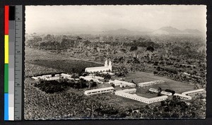 Aerial view of a Catholic mission and church, Cameroon, ca.1920-1940