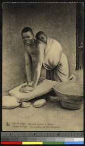 Grinding the flour, Congo, ca.1920-1940