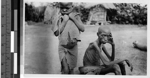 Two siblings in a clearing, Africa, October 1949