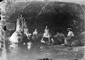 Missionary family and Africans at a river, Tanzania, ca.1893-1920