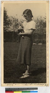 Missionary girl holding a kitten, Zhenjiang, Jiangsu, China, 1933