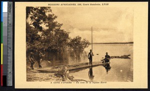 Boat at the shore of the Ebrie lagoon, Ivory Coast, ca.1900-1930