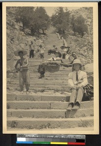 Missionaries being carried down steps, Tai Shan, Shandong, China, ca. 1910