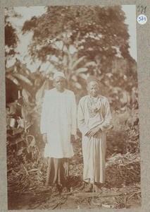 2 African men with long fabric garbs and cap, Africa, ca.1900-1914