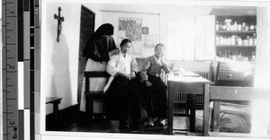 Sister Edwardine tending patients at Maryknoll dispensary, Gishu, Korea, April 15, 1932