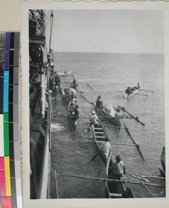 Outrigger canoes along the side of the ship, Morondava, Madagascar