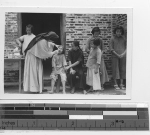 Maryknoll Sister at dispensary at Jiangmen, China, 1947