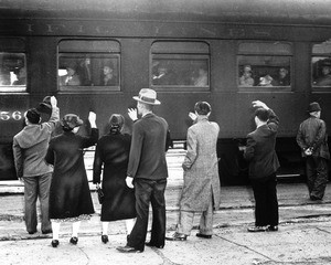 "Families and friends of the Japs who departed by train line the platform to bid them good-by for the duration of the war. There were 500 men in this contingent."--caption on photograph