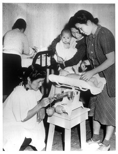 "Daily the Baby Clinic at Santa Anita Assembly center is crowded like this."--caption on photograph