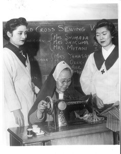 "Japanese-Americans sew for Red Cross. Demonstrating their loyalty to this country, members of the Japanese-Alameda Citizens League of Alameda are working around the clock to produce garments for distribution to war victims"--caption on photograph