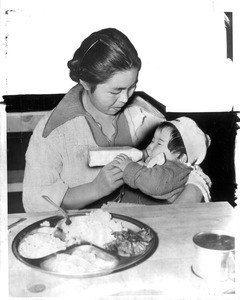 "Good Food and plenty of it is served to the Japanese evacuees at the Santa Anita reception center"--caption on photograph