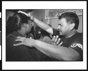 Man blessing woman in prayer, Victory Outreach Church, North Hollywood, California,1996