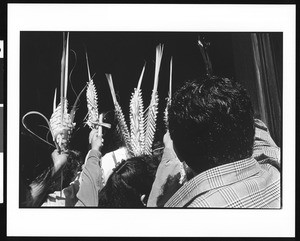 People raising palms on Palm Sunday at Saint Thomas Church (Los Angeles, Calif.), 1996