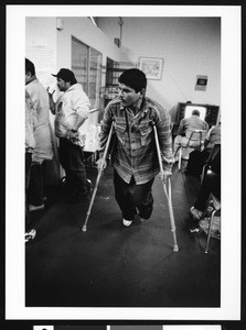 Man with crutches, Los Angeles, 1999